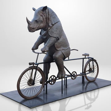 The Javan Rhino Races on the Bicycle (Bronze Sculpture)