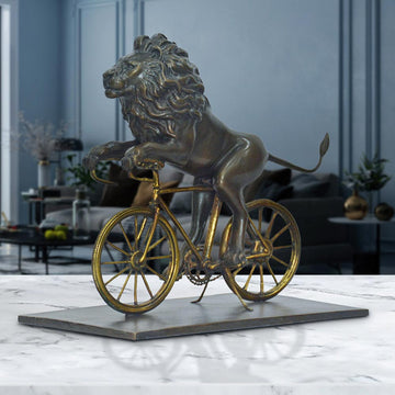 The Lion Races Against Time on the Bicycle (Bronze Sculpture, Small)