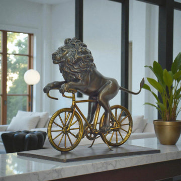 The Lion Races Against Time on the Bicycle (Bronze Sculpture, Small)