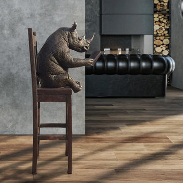 Rhino Above It All, Lost in a Good Story (Bronze Sculpture, Mid-Size)