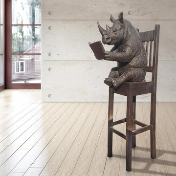 Rhino Above It All, Lost in a Good Story (Bronze Sculpture, Mid-Size)