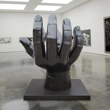 A Rhino in a Big Hand (Bronze Sculpture)