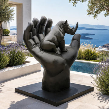 A Rhino in a Big Hand (Bronze Sculpture)