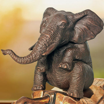 The elephant has a crush on tanks (Bronze Sculpture)