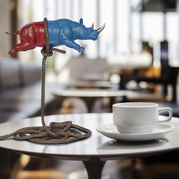 Flying Psychedelic Rhino on short rope (Bronze Sculpture)