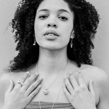 He whispered sweet nothings into her ears (Earrings)