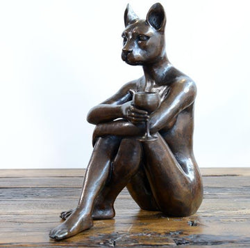 She thought it was time to cut down on the red wine and switch to white (Bronze Sculpture)